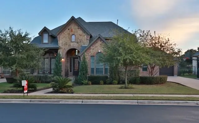 a front view of a house with a yard