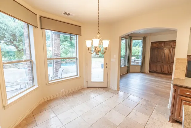 a view of livingroom with furniture wooden floor and windows