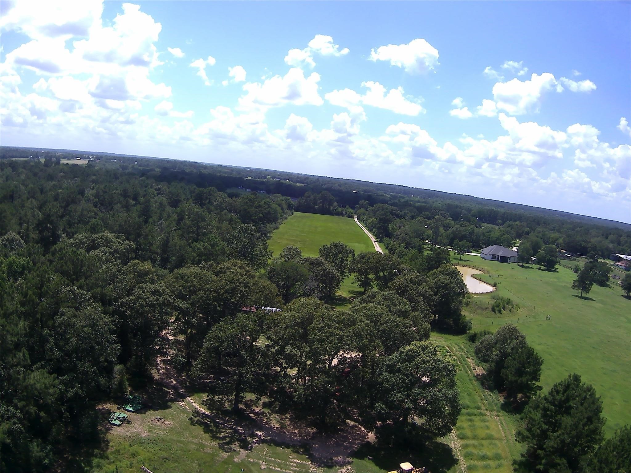 2264 North Fm 1486 Road Montgomery, TX 77356 - Photo 5 of 6 a view of a lake with a houses