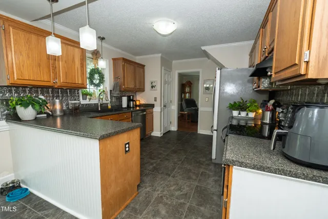 a kitchen with sink cabinets and window