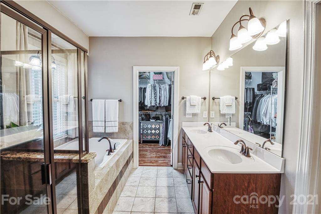 700 Revival Row Fort Mill, SC 29708 - Photo 22 of 44 a bathroom with a tub sink and mirror