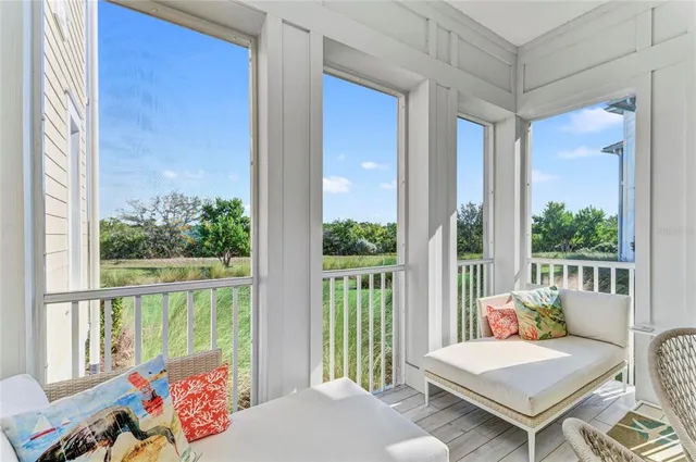 a view of a livingroom with workspace and a couch
