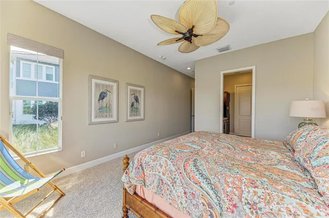 a living room with lots of furniture and kitchen view