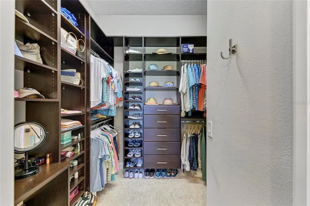a outdoor space with lots of wooden furniture and large windows