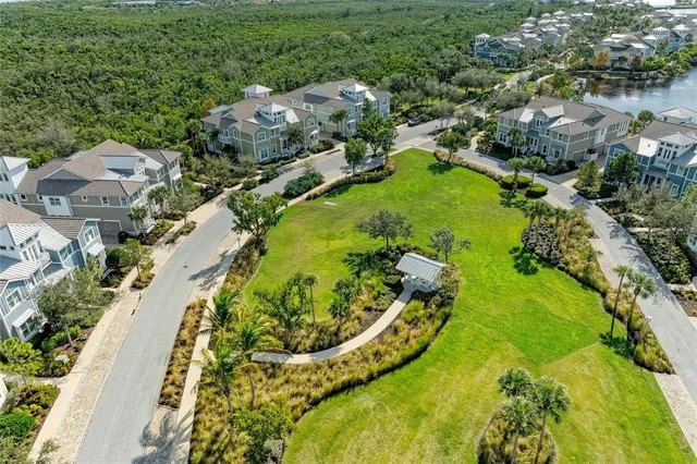 a living room with fireplace furniture and a potted plant