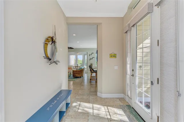 a living room with furniture a rug and a chandelier