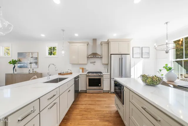 a stove top oven sitting inside of a kitchen