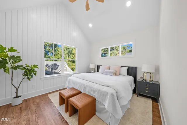 a living room with furniture and a dining table with kitchen view