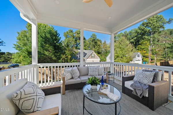 a bathroom with a granite countertop toilet sink and mirror