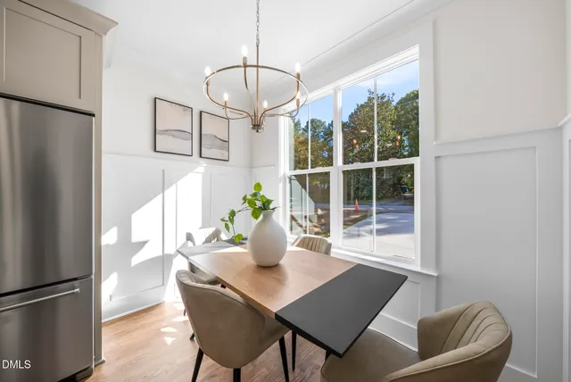 a kitchen with stainless steel appliances a refrigerator and a stove top oven