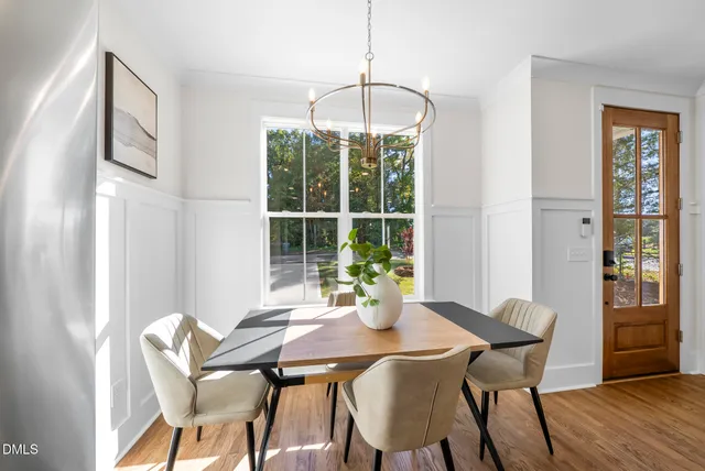 a view of a dining room with furniture window and outside view