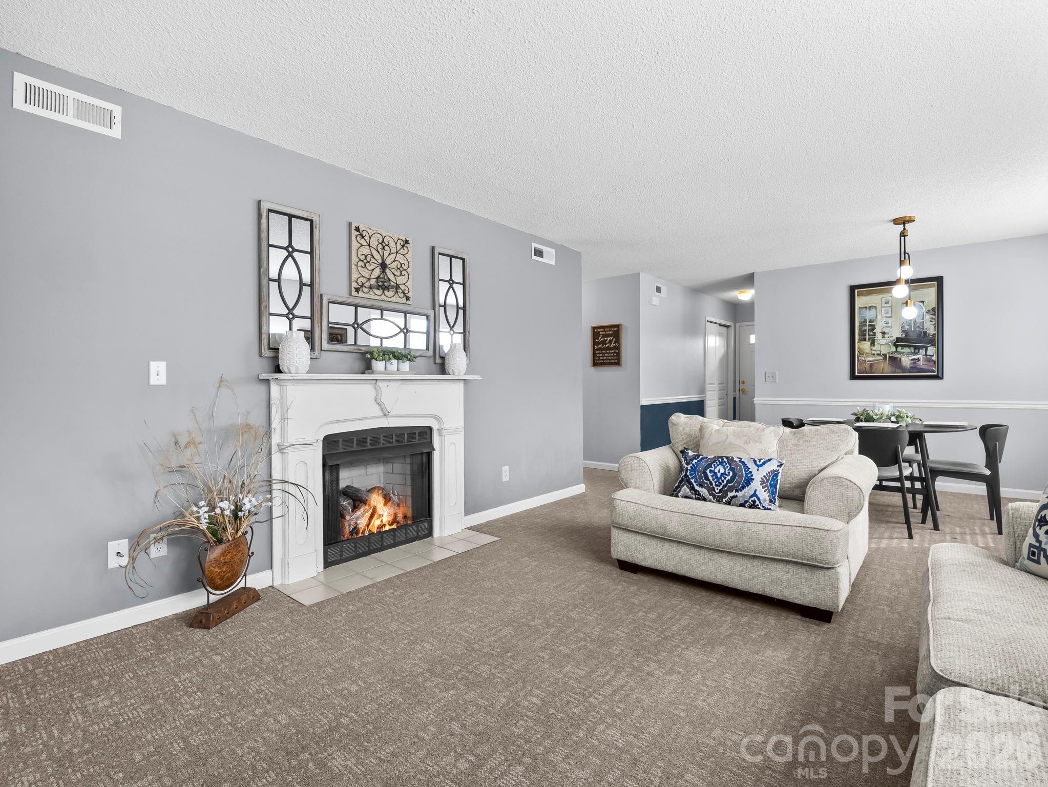 1002 Deermouse Way Hendersonville, NC 28792 - Photo 1 of 42 a living room with furniture and a fireplace