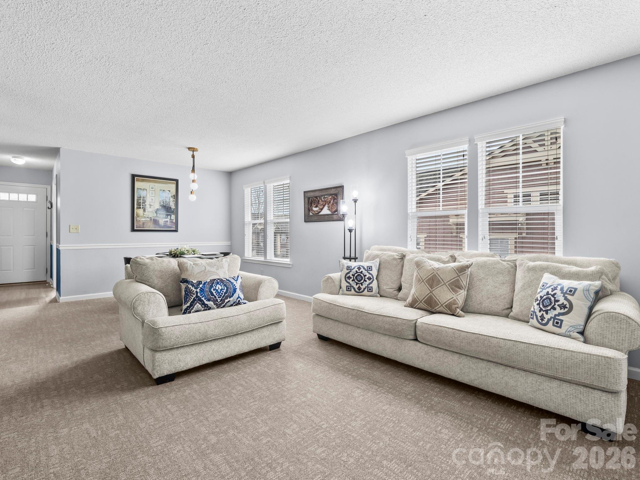 1002 Deermouse Way Hendersonville, NC 28792 - Photo 19 of 42 a living room with furniture and windows
