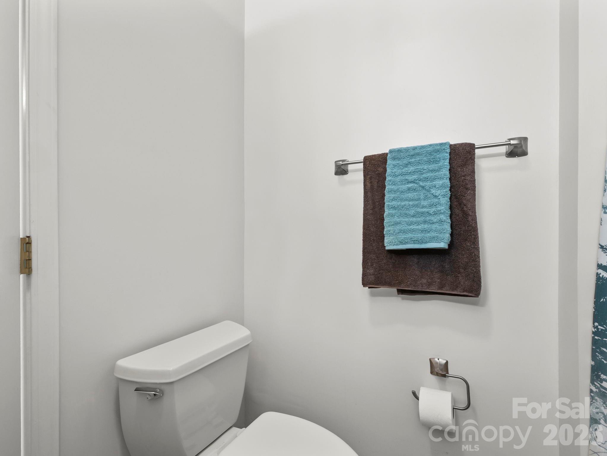 1002 Deermouse Way Hendersonville, NC 28792 - Photo 23 of 42 a bathroom with a toilet and a sink