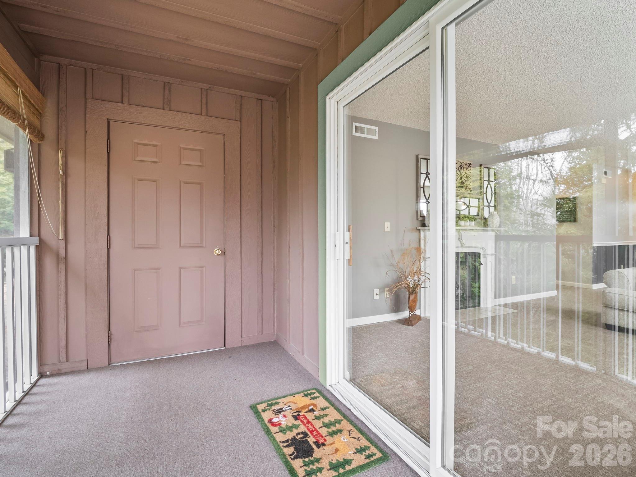 1002 Deermouse Way Hendersonville, NC 28792 - Photo 29 of 42 a view of a bathroom with a glass door and a glass door