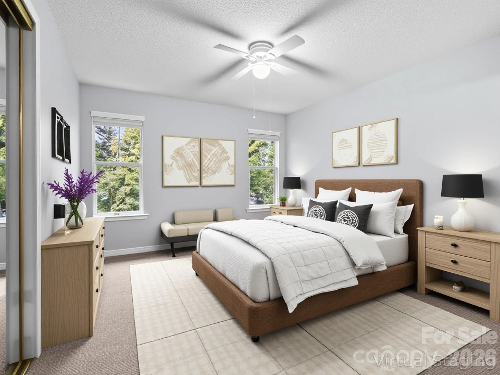 1002 Deermouse Way Hendersonville, NC 28792 - Photo 4 of 42 a spacious bedroom with a large bed and a window