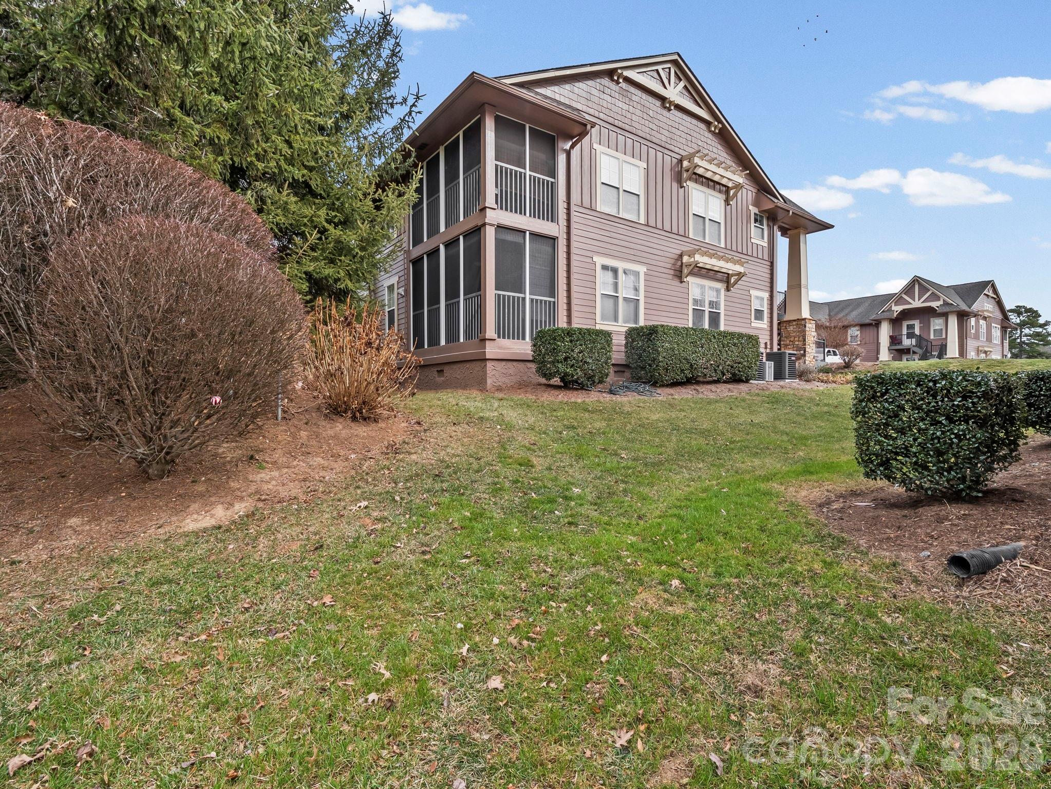 1002 Deermouse Way Hendersonville, NC 28792 - Photo 8 of 42 a front view of a house with a yard