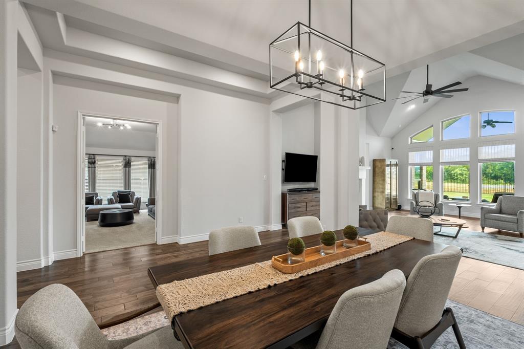 11504 Antler Ridge Way Argyle, TX 76226 - Photo 14 of 40 Dining area with peek into the media room across the hall. Again, you have a wonderful pic of the wall of windows in the living room.