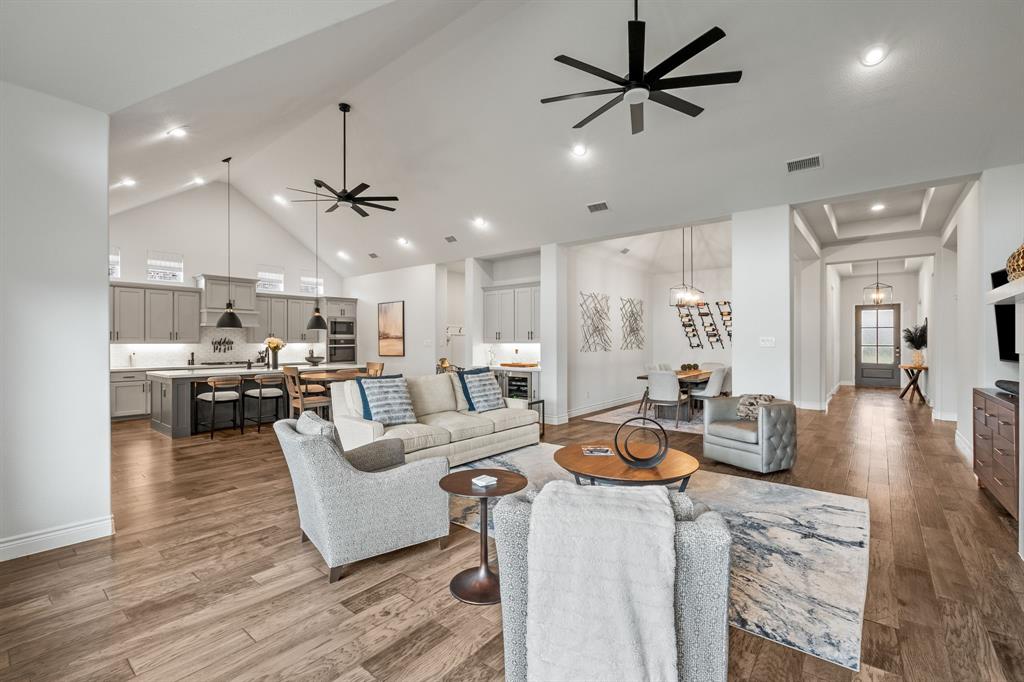 11504 Antler Ridge Way Argyle, TX 76226 - Photo 17 of 40 This photo really encompasses the heart of the home. Each room has great space, whether it's just for you or if you invite friends over for a gathering.