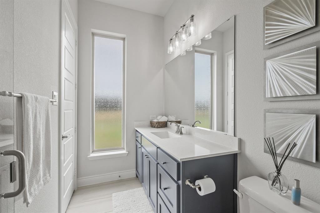11504 Antler Ridge Way Argyle, TX 76226 - Photo 22 of 40 This ensuite bath has a large window which allows a ton of light into the bathroom.