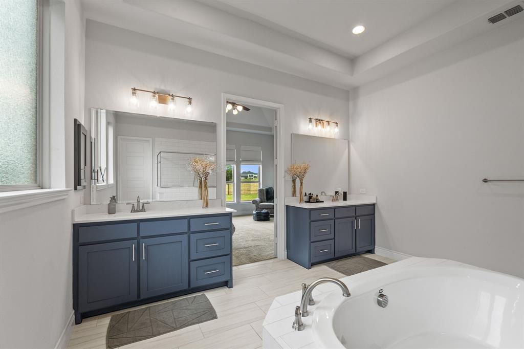 11504 Antler Ridge Way Argyle, TX 76226 - Photo 27 of 40 A view of the bath as well as the dual vanities/sinks. Plenty of storage place!