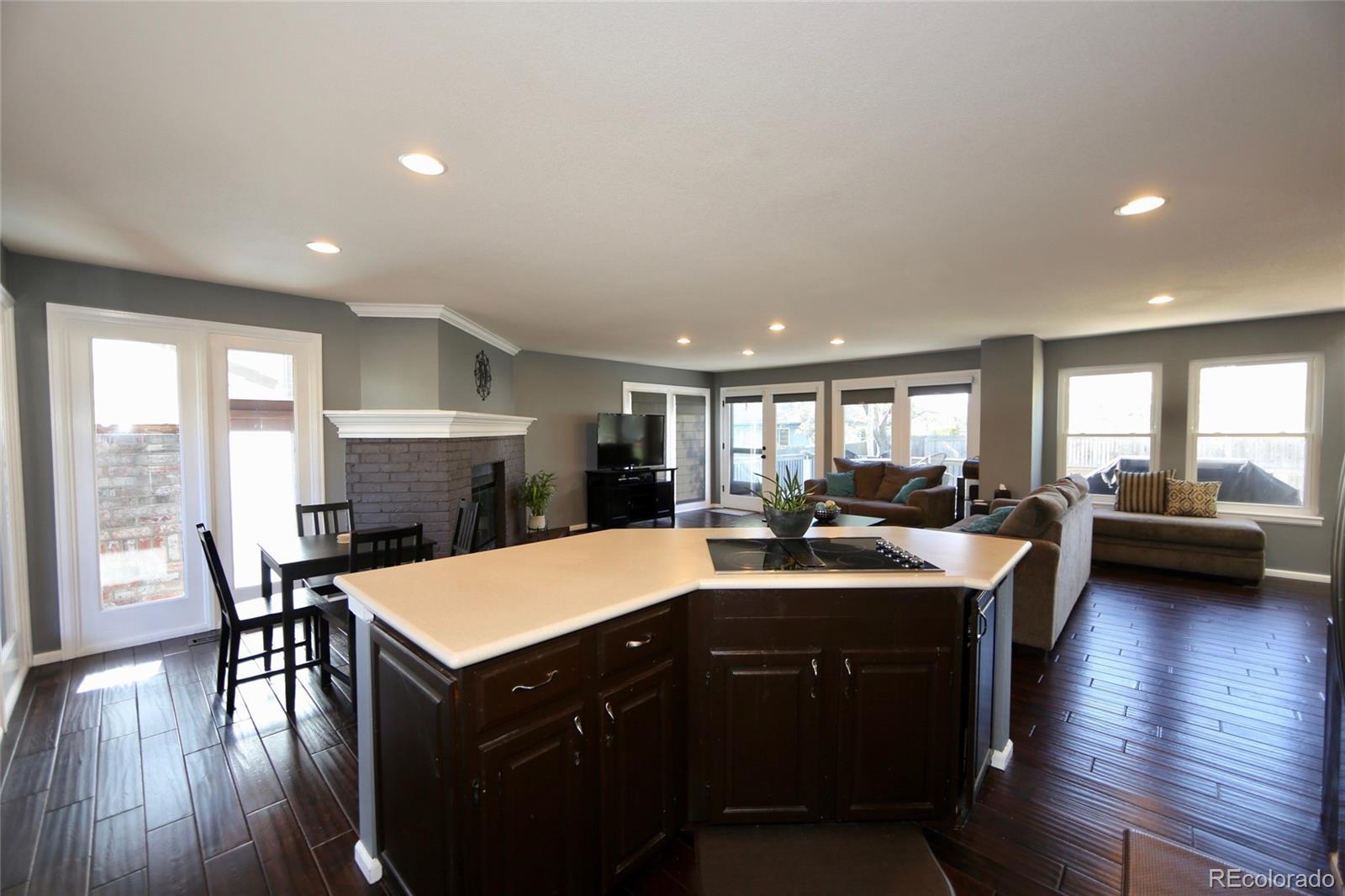 7968 Chaparral Road Lone Tree, CO 80124 - Photo 8 of 32 a view of a dining room with furniture and wooden floor
