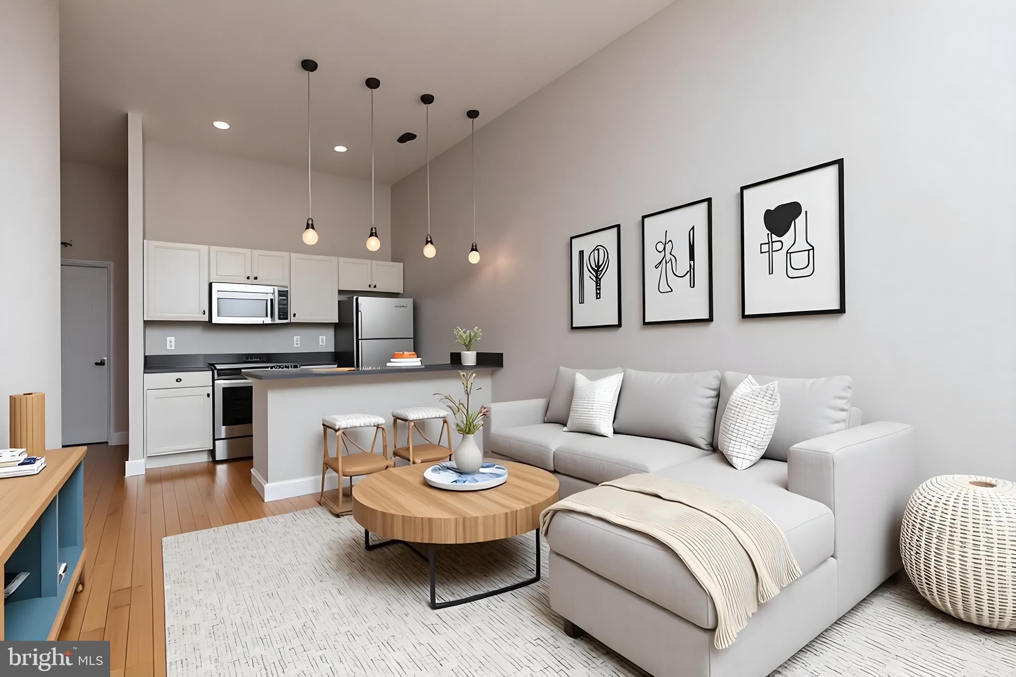 a living room with furniture and a view of kitchen