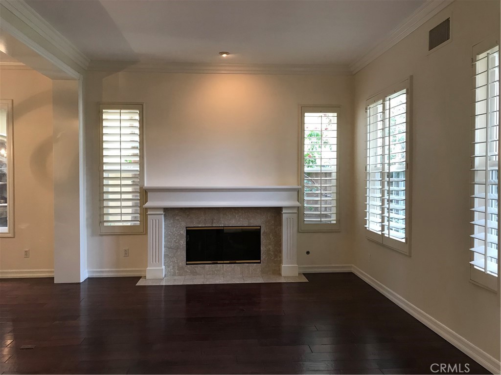 3 Garnet Irvine, CA 92620 - Photo 2 of 15 a view of an empty room with wooden floor and a window