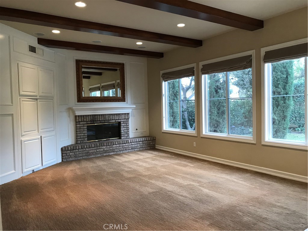 3 Garnet Irvine, CA 92620 - Photo 6 of 15 a view of empty room with a fireplace and windows