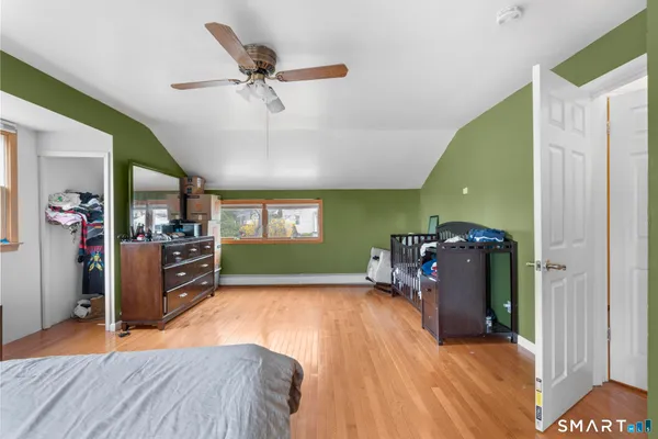 a view of a livingroom with a window and a ceiling fan