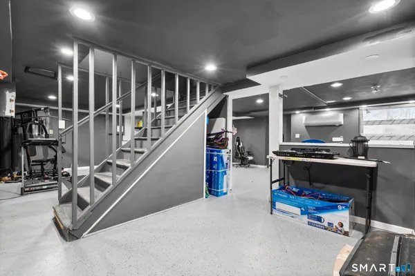 a white toilet sitting next to a bathroom sink