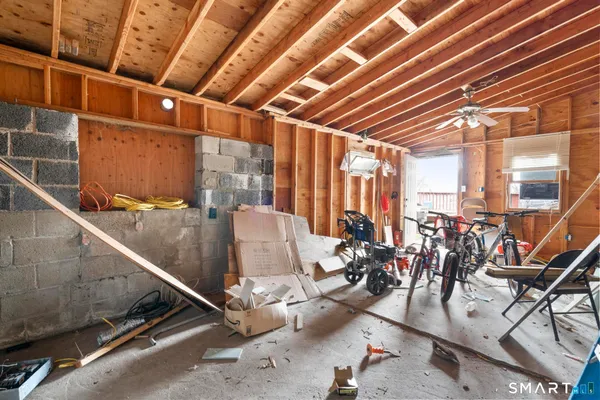 a view of a house with pool and sitting area