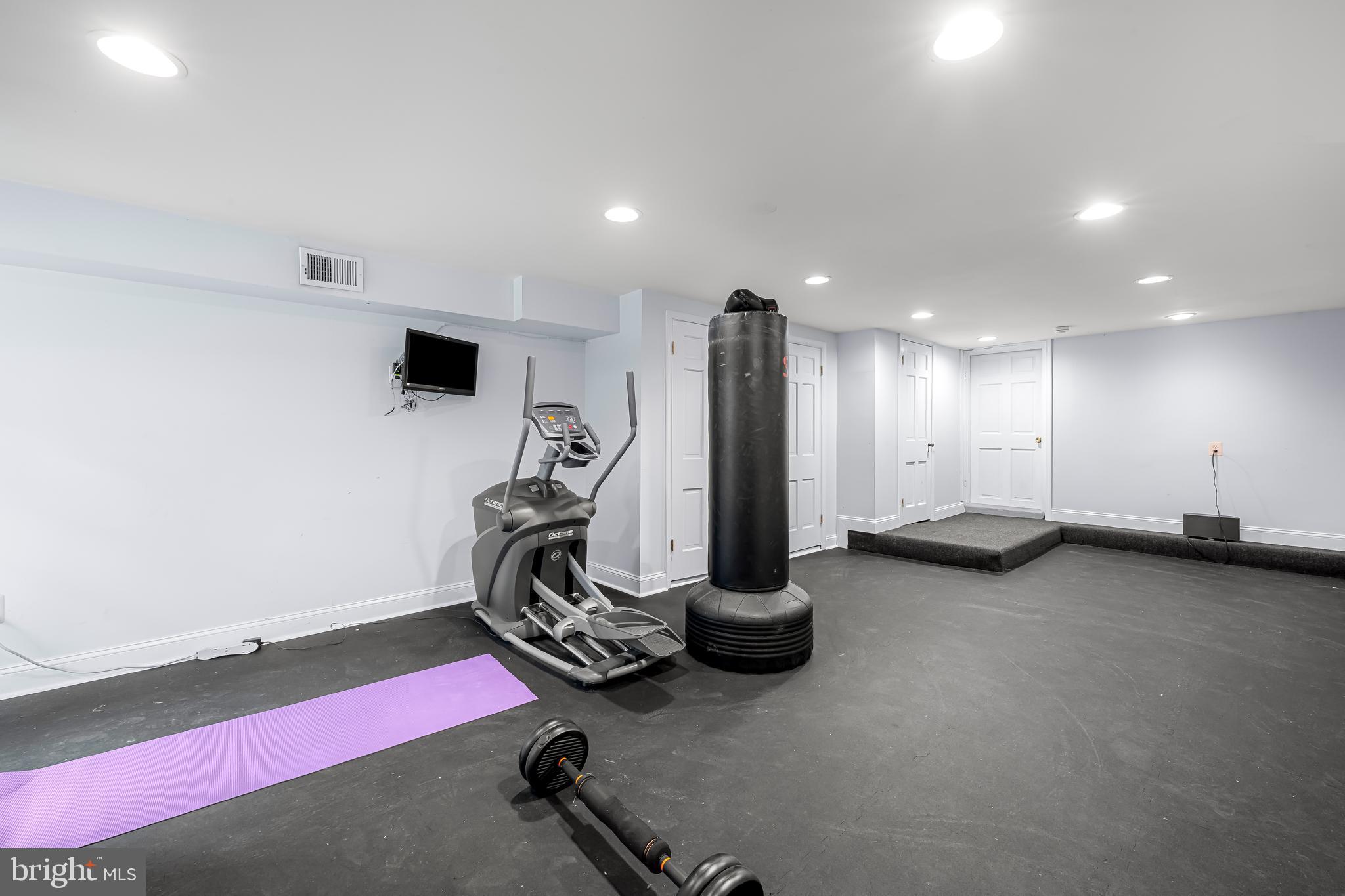 217 Wendover Road Baltimore, MD 21218 - Photo 44 of 73 Lower level recreation room currently used as gym