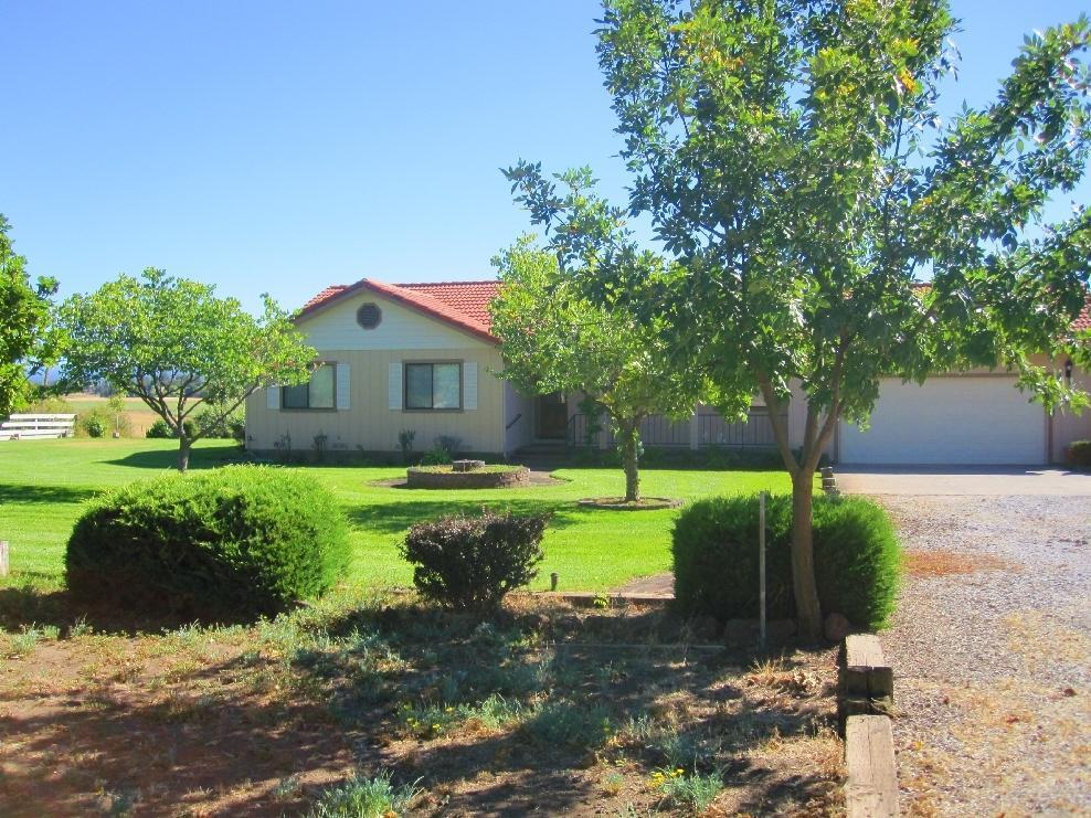 45541 Pittville Road McArthur, CA 96056 - Photo 1 of 26 a front view of a house with garden