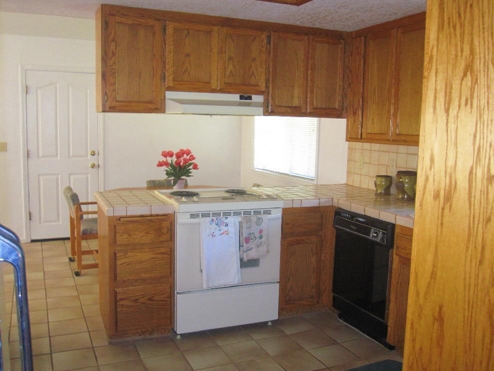45541 Pittville Road McArthur, CA 96056 - Photo 21 of 26 a kitchen with a stove a sink and a refrigerator