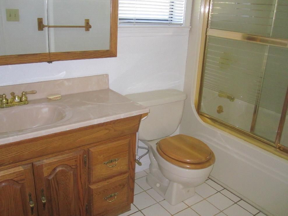 45541 Pittville Road McArthur, CA 96056 - Photo 26 of 26 a bathroom with a granite countertop toilet and a sink