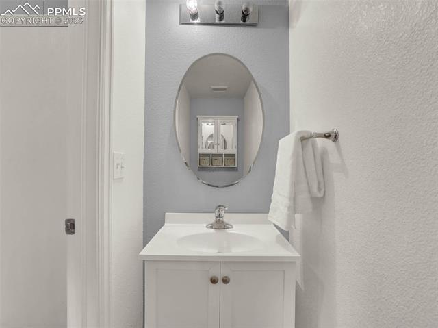 5347 Gentle Wind Road Colorado Springs, CO 80922 - Photo 14 of 28 Powder room on the main level.