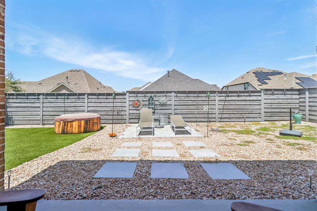 847 Longbranch Way Little Elm, TX 76227 - Photo 29 of 39 Fenced backyard with a patio, a hot tub, and a residential view