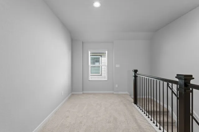 a view of a hallway with a window