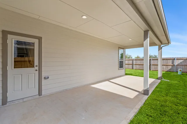 a view of an empty room with a floor to ceiling window
