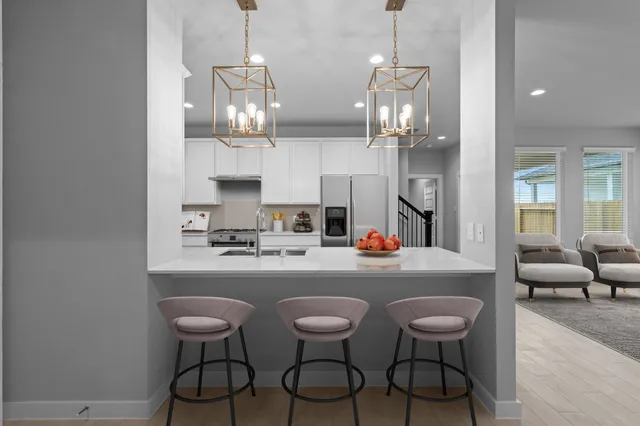 a room with dining table and chairs