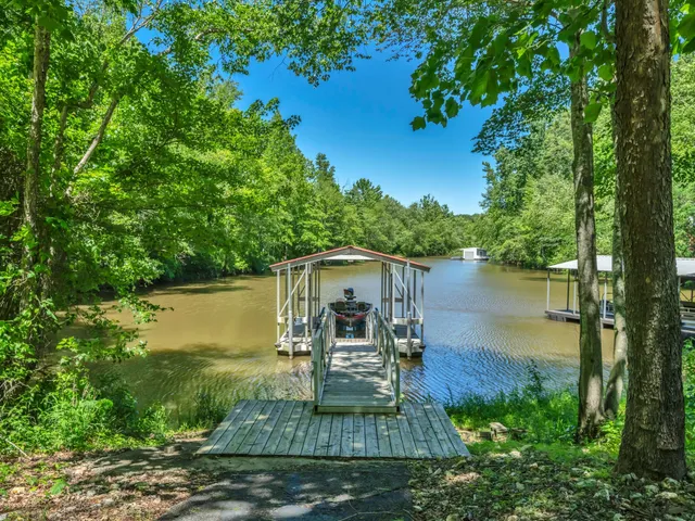a view of swimming pool with sitting area