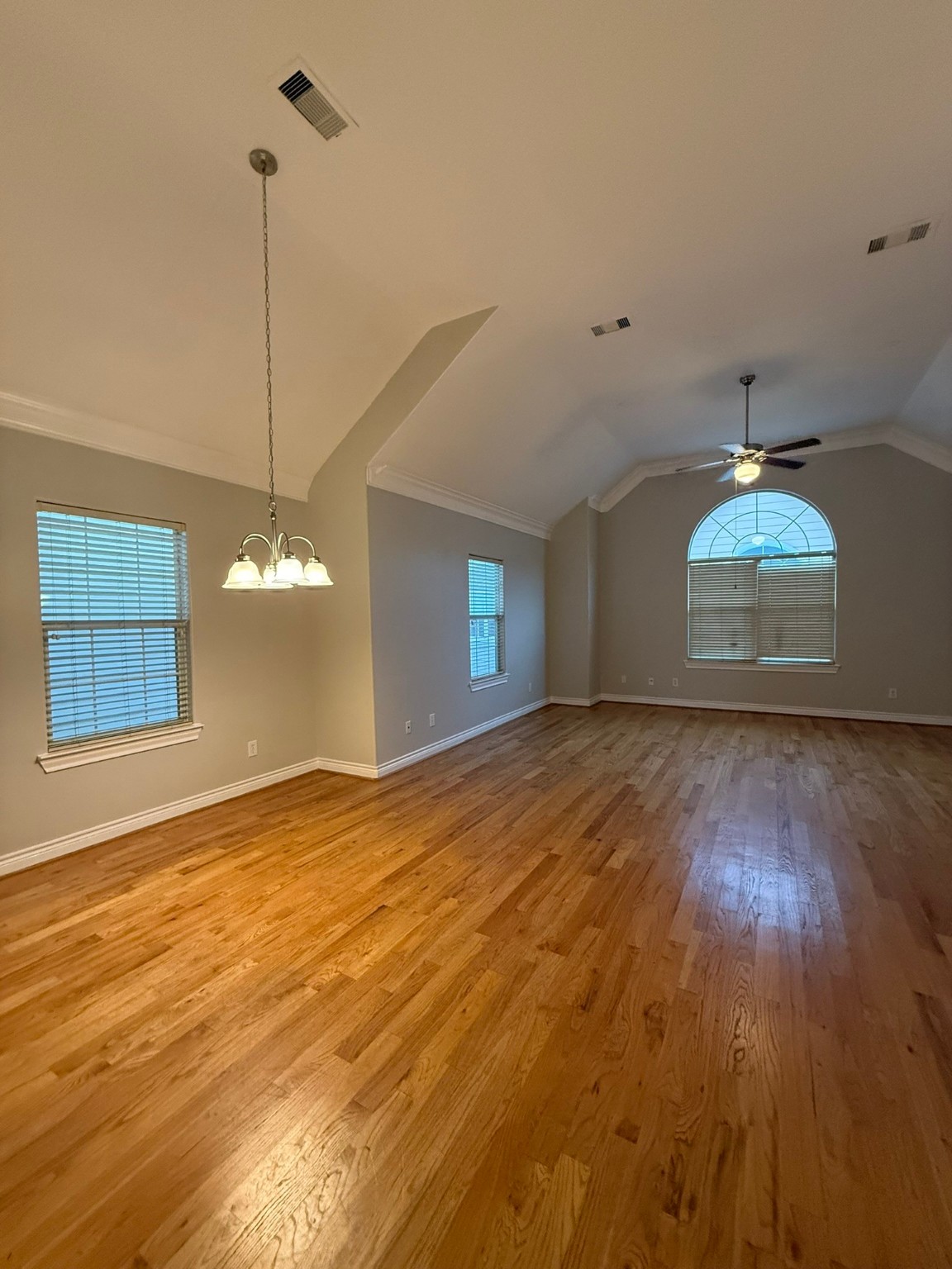 2939 Clinton Drive Houston, TX 77020 - Photo 14 of 20 a view of an empty room with window and wooden floor