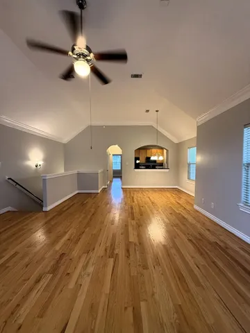 a view of a room with a wooden floor