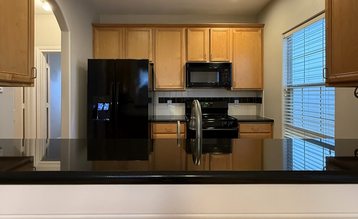 2939 Clinton Drive Houston, TX 77020 - Photo 6 of 20 a kitchen with a refrigerator and a microwave