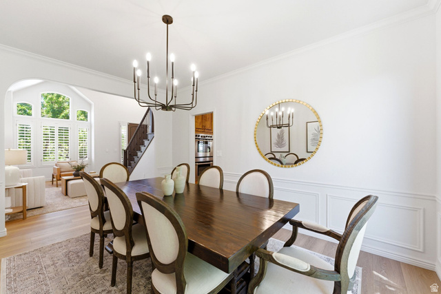 1712 Somerset Ridge Drive Draper, UT 84020 - Photo 15 of 76 Dining area featuring light wood-finish flooring and a contemporary chandelier