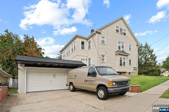 a car parked in front of a house