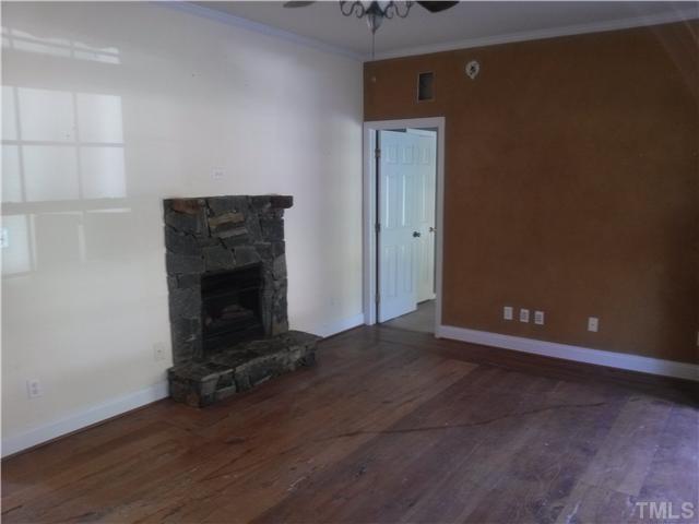 621 Sawmill Road West Cedar Grove, NC 27231 - Photo 4 of 16 Living room boast natural hardwood flooring and a gas fireplace!