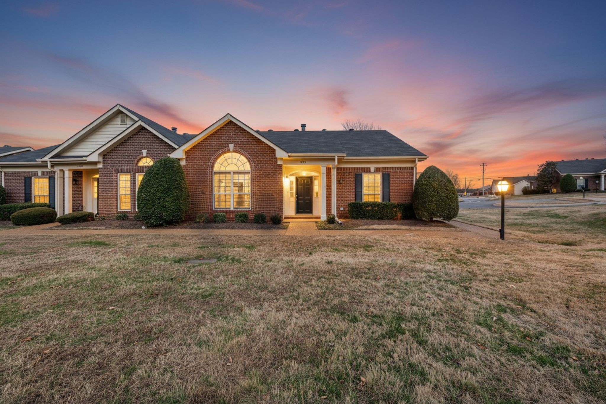 a front view of a house with a yard