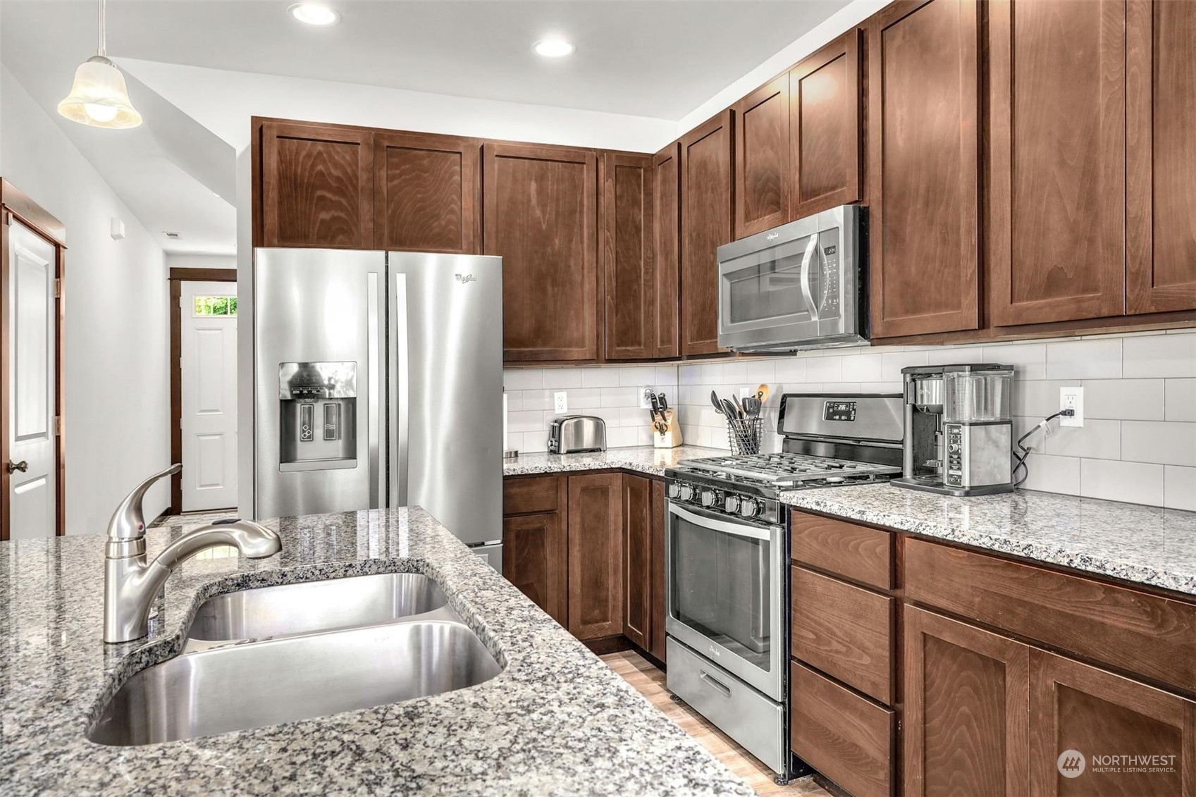 17801 3rd Avenue Southeast Bothell, WA 98012 - Photo 12 of 40 a kitchen with stainless steel appliances granite countertop a sink stove and refrigerator